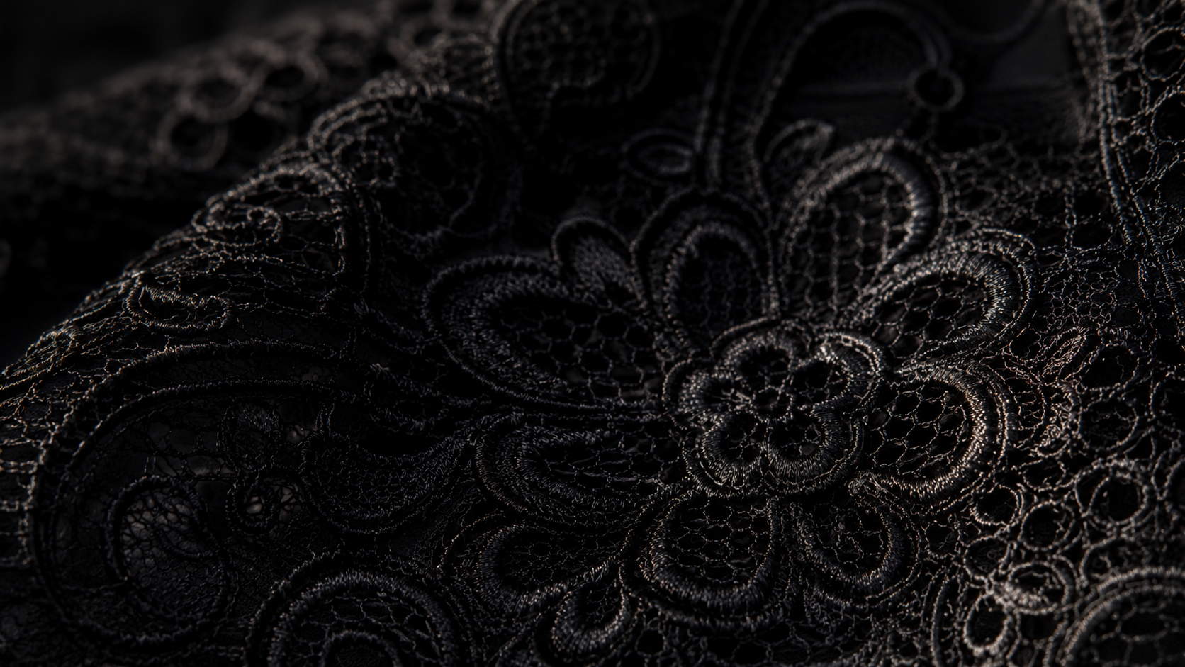 Noir lace editorial texture on dark background
