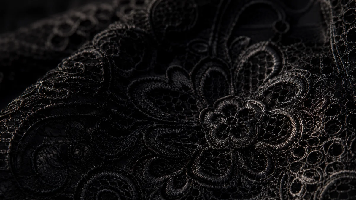 Noir lace editorial texture on dark background